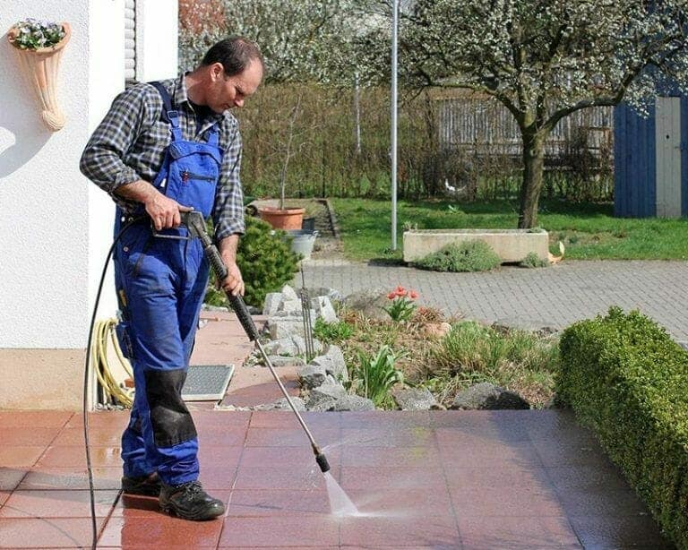 Pressure washing driveway and patio surfaces